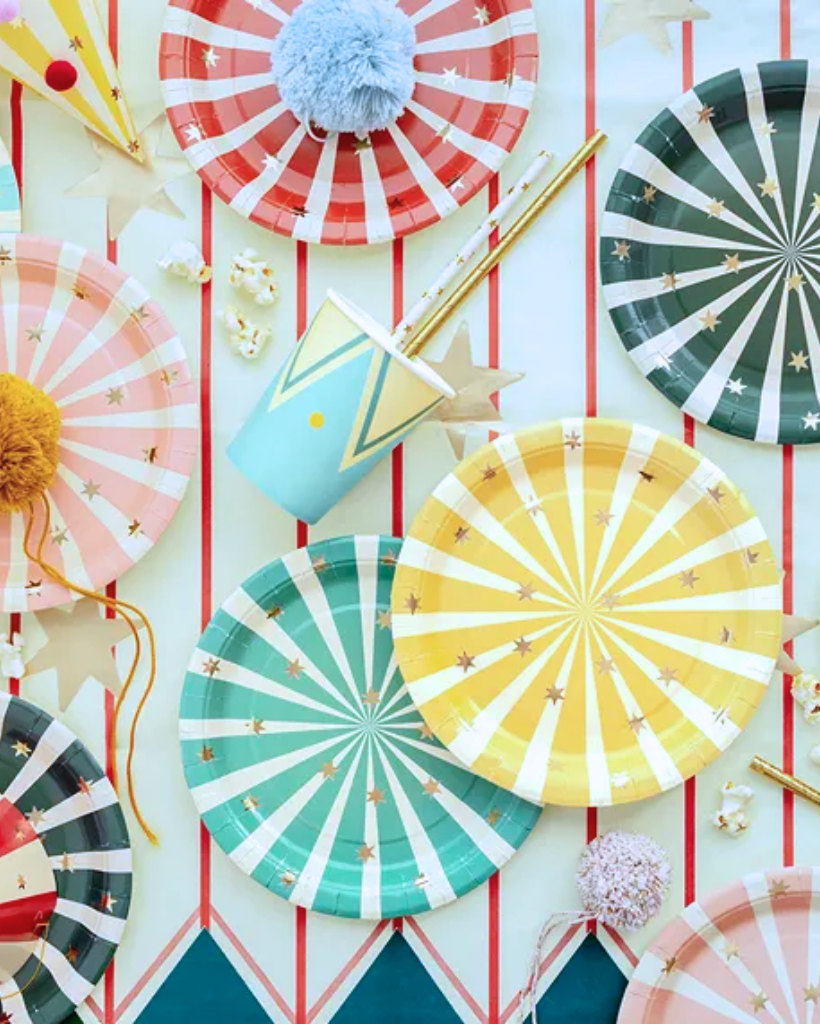Small striped paper plates with gold foil stars for circus themed party