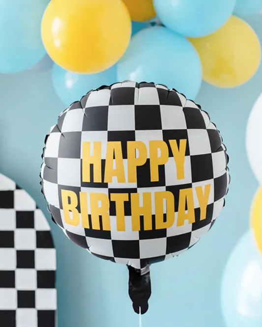 Checkered 'Happy Birthday' balloon with blue and yellow balloons in the background