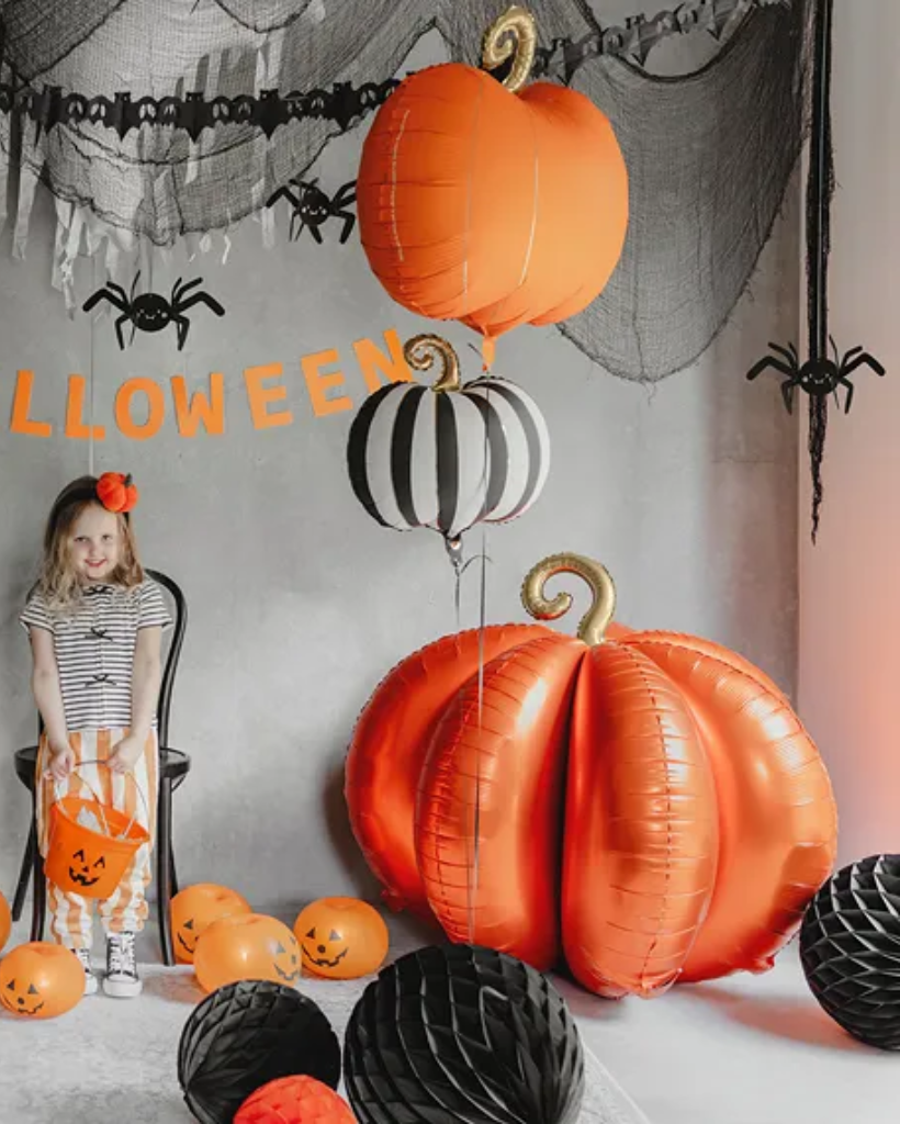 Orange pumpkin-shaped balloon with a gold stem for halloween decorations