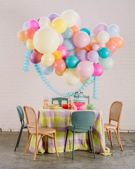 DIY balloon garland kit with pops of neon with pastels. Pastel neon party theme set up.
