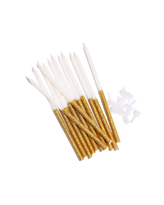 white cake candles dipped in fine gold glitter