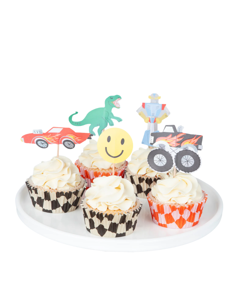 Cupcakes with vehicle-themed toppers on a white plate