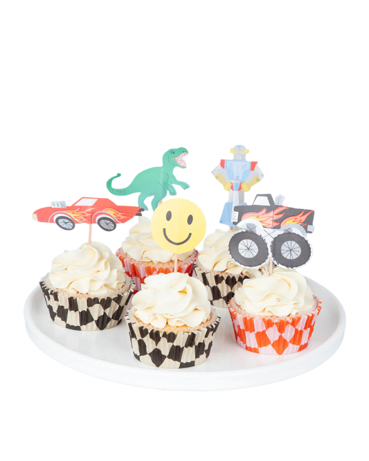 Cupcakes with vehicle-themed toppers on a white plate