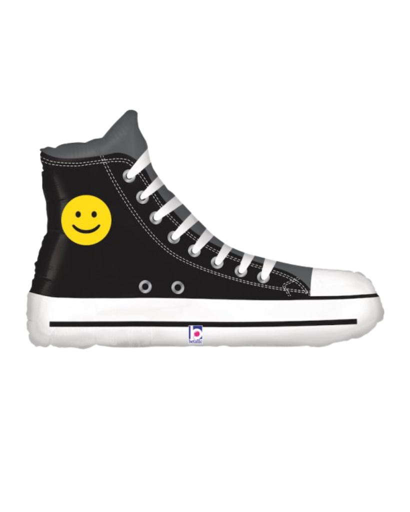 Black high-top converse sneaker with a yellow smiley face foil balloon