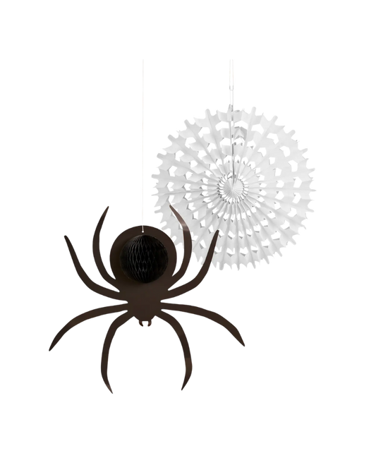 Black spider decoration with a white paper fan on a white background