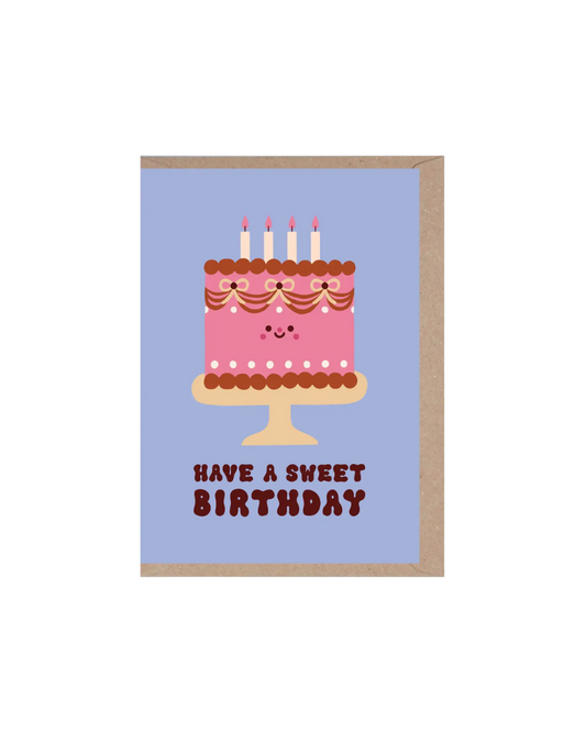 Greeting card with a pink cake illustration and 'Have a Sweet Birthday' text on a blue background.