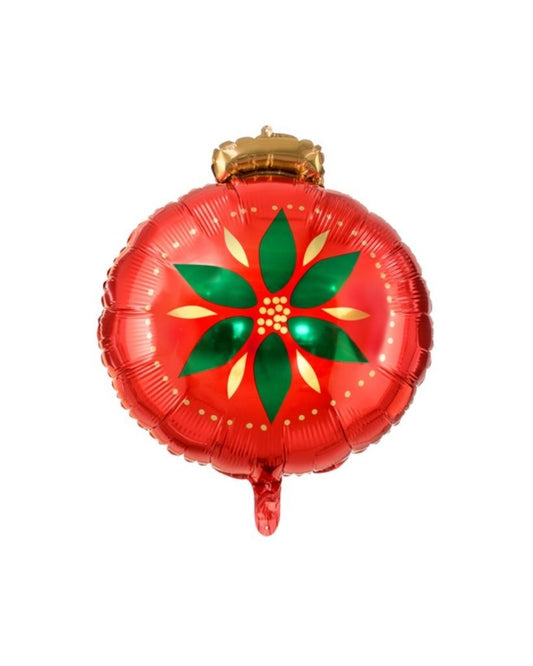 A round, red balloon with a Christmas bauble design, featuring a star-like pattern with green and gold accents, tied at the top with a gold ribbon.