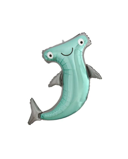 A helium-filled balloon in the shape of a hammerhead shark with a happy expression, predominantly in a light blue color.