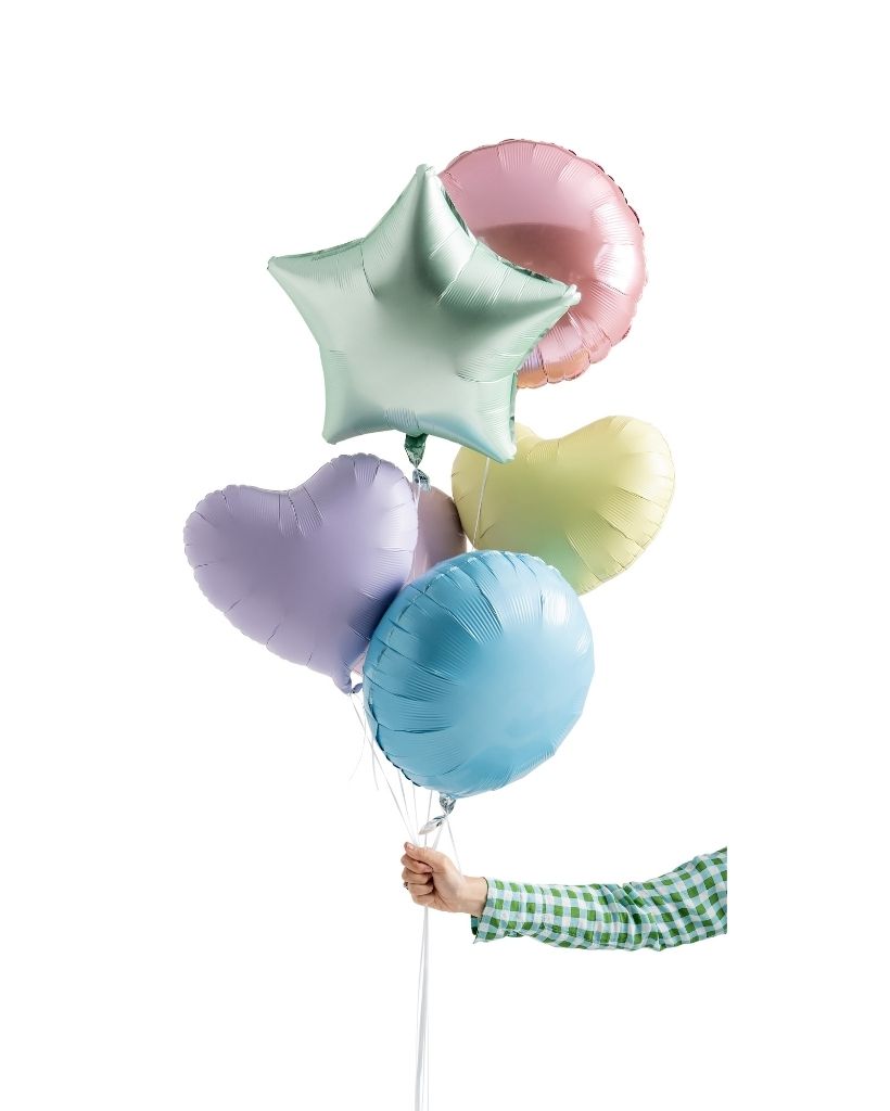A set of pastel-colored foil balloons, including stars, in shades of pink, green, blue, and purple, tied together with a string.
