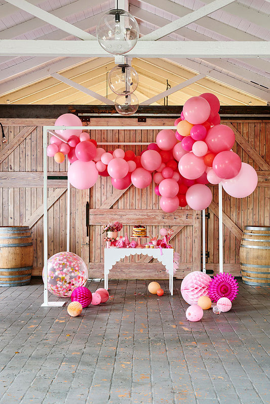 pink shimmer balloon garland party set up